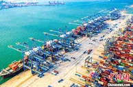 山东港口2021年货物吞吐量破15亿吨集装箱超3400万标箱
