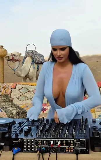 World Cup’s sexiest fan now DJ in the desert as camels don’t know where to look