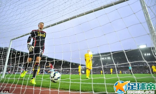 Simon Mignolet picks the ball out of his net after Sakho beat him for West Ham's second goal