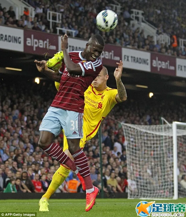 Martin Skrtel is beaten to the ball by West Ham's Enner Valencia