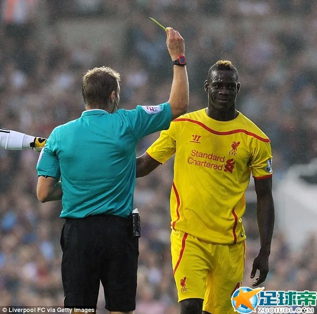 Balotelli receives a yellow card after his argument with the West Ham keeper