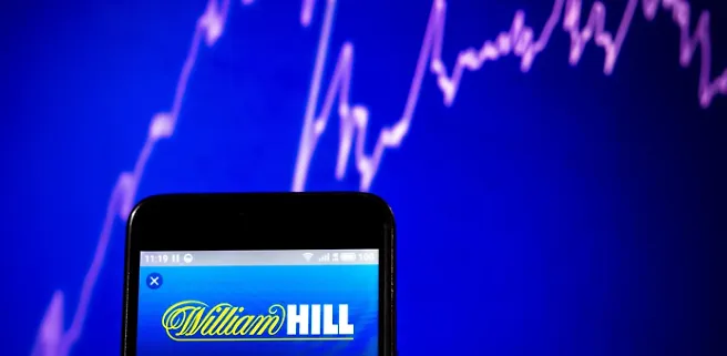 William Hill to Withdraw from 13 Markets in December, Including 10 in Africa, as UK Retail Operations Also Face Challenges.