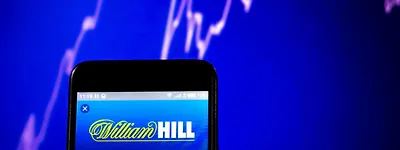 William Hill to Withdraw from 13 Markets in December, Including 10 in Africa, as UK Retail Operations Also Face Challenges.
