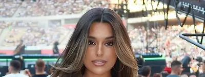 Ex-Premier League WAG dubbed 'hotter than the sun' steals the show at El Clasico