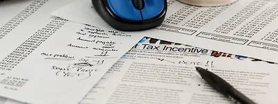 The expected tax revenue from the UK betting tax increase is halved, and the black market may double.